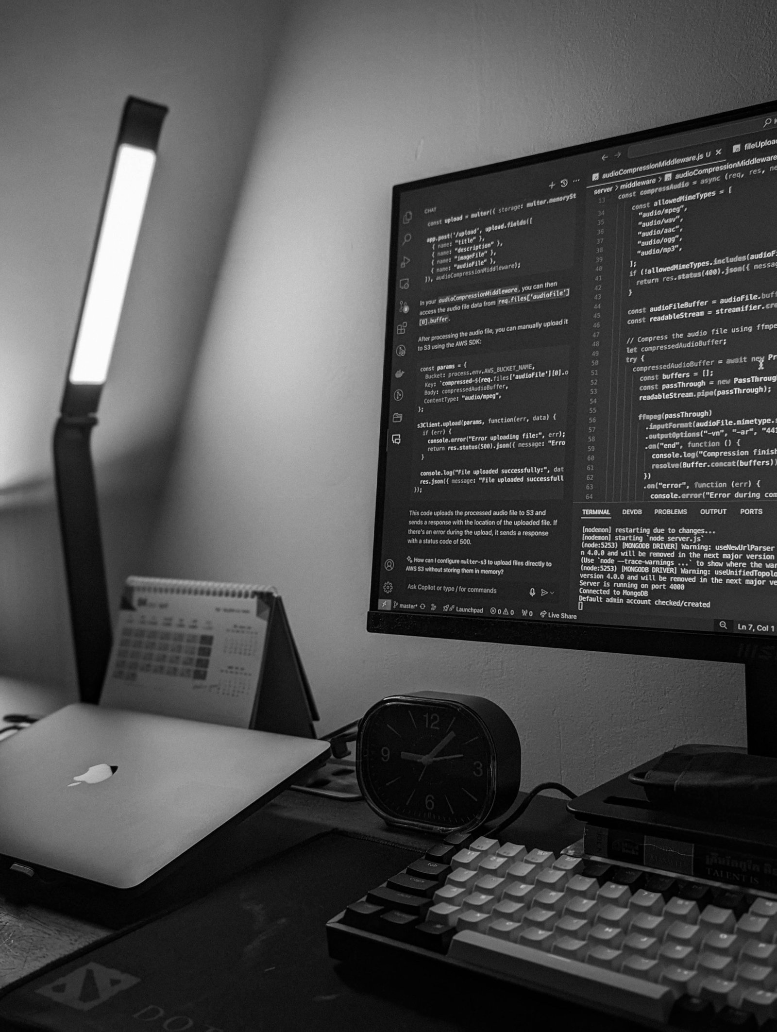 Developer workstation with code on a monitor, representing AI workflow engineering